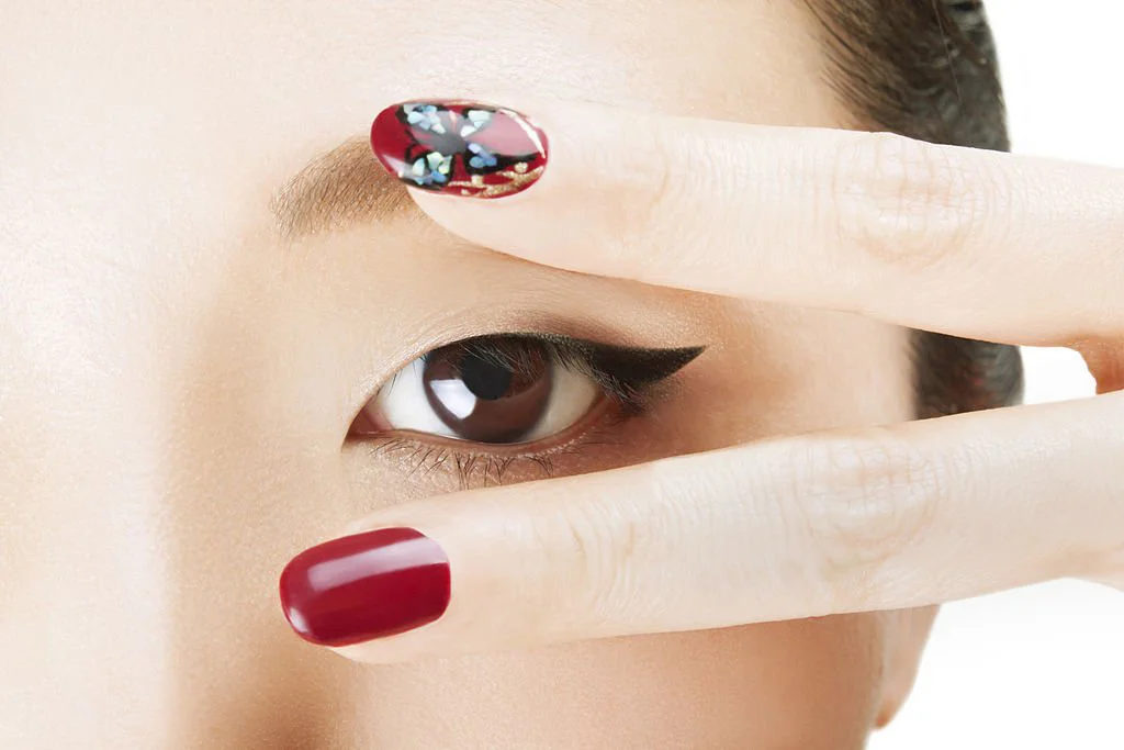 Asian face with manicured nails at Bangkok Beauty Studio nail spa Thailand